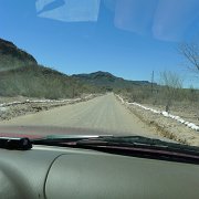 Somebody went to quite an effort to line the dirt road with white painted rocks. : Baja2011